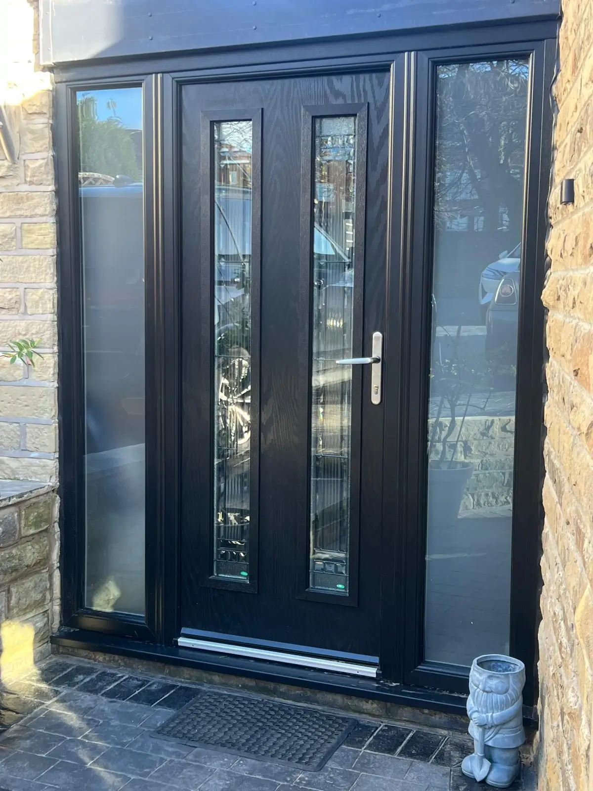Black composite door and side panels in Leeds